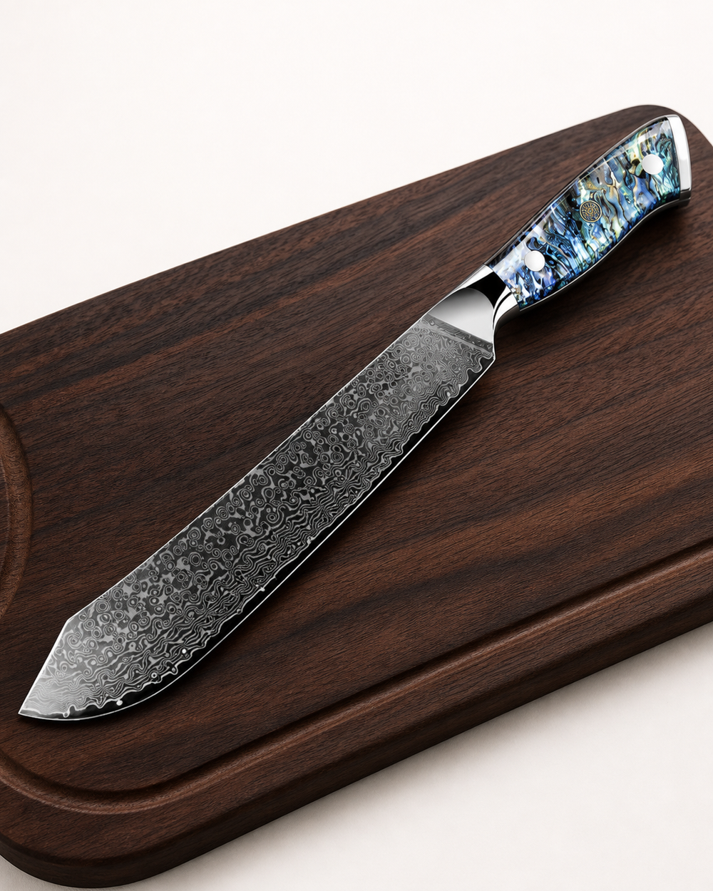 Damascus-pattern kitchen knife on a walnut board